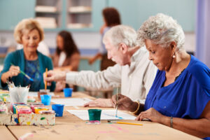 Group Of Retired Seniors Attending Art Class